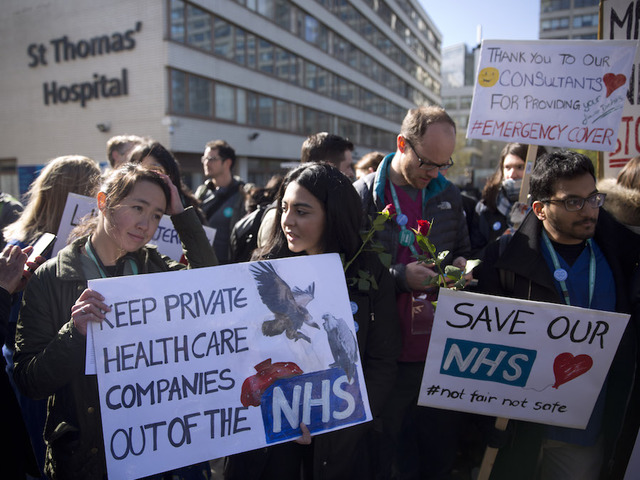 Thousands of UK doctors walk off job in strike