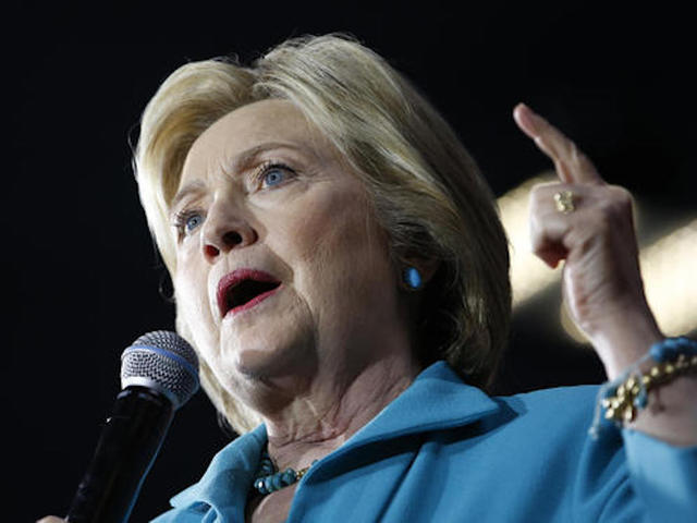 Clinton slams Trump in media session