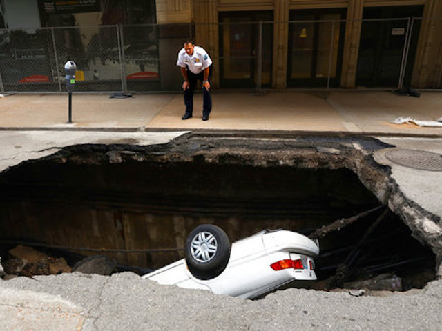 Sinkhole swallows up car in downtown St. Louis; no injuries