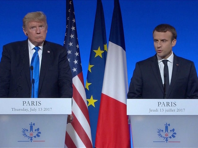 Trump defends son in Paris press conference