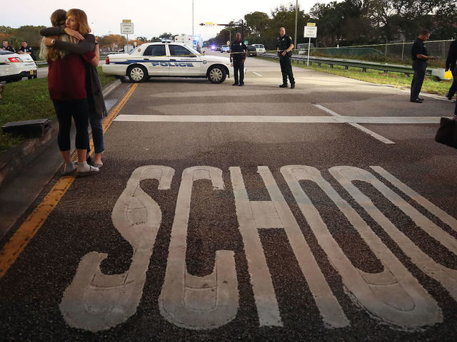 Trump pledges to 'ease pain' following Florida high school mass shooting