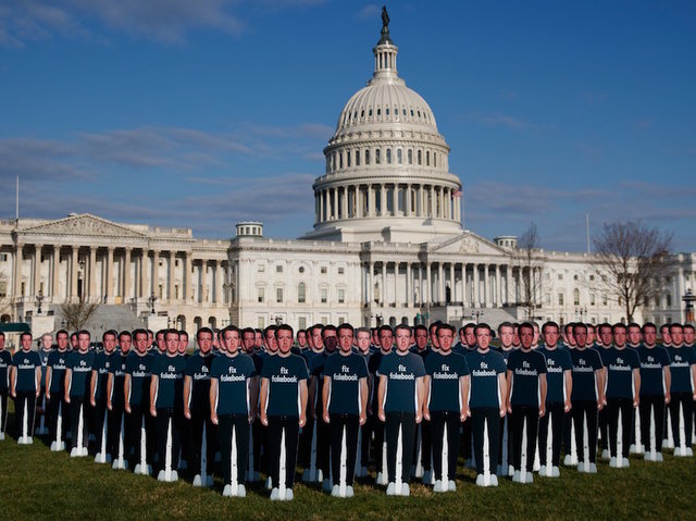 100 Mark Zuckerberg cutouts placed on Capitol Hill lawn