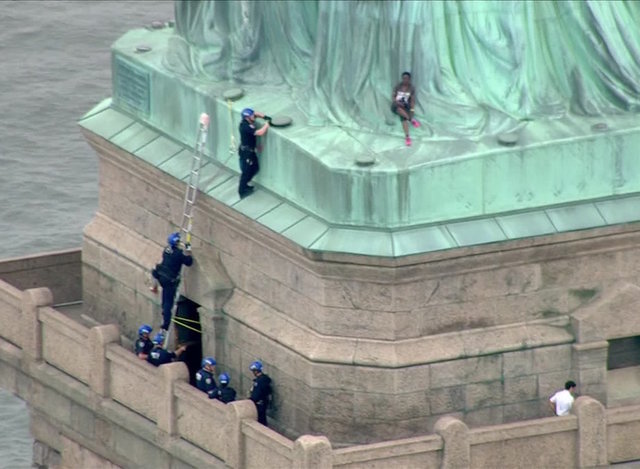 Woman who climbed Statue of Liberty's base is federally charged, faces time in prison