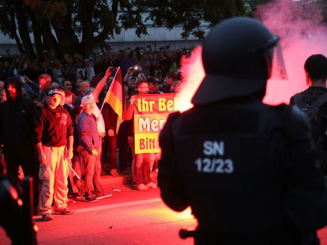 Thousands of far-right and anti-Nazi protesters clash over Chemnitz stabbing