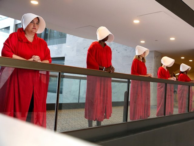 Silent protesters dressed as 'handmaids' have a very loud message: Stop Kavanaugh