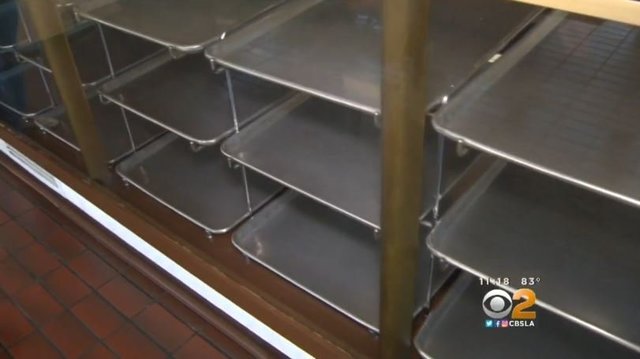 Doughnut shop's owner has sick wife; customers help by quickly buying shop's inventory